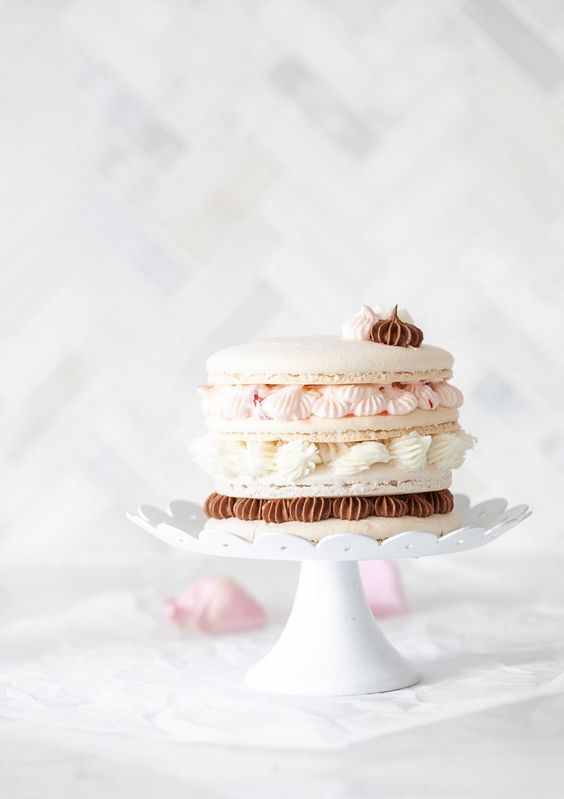 a stylish macaron cake with vanilla, raspberry and chocolate cream inside and on top will be a cool alternative to a usual wedding cake
