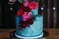 a teal textural wedding cake with burgundy, red, pink blooms and thistles is a great idea for a fall wedding in jewel tones