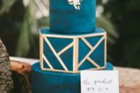 a glamorous wedding cake with gold details