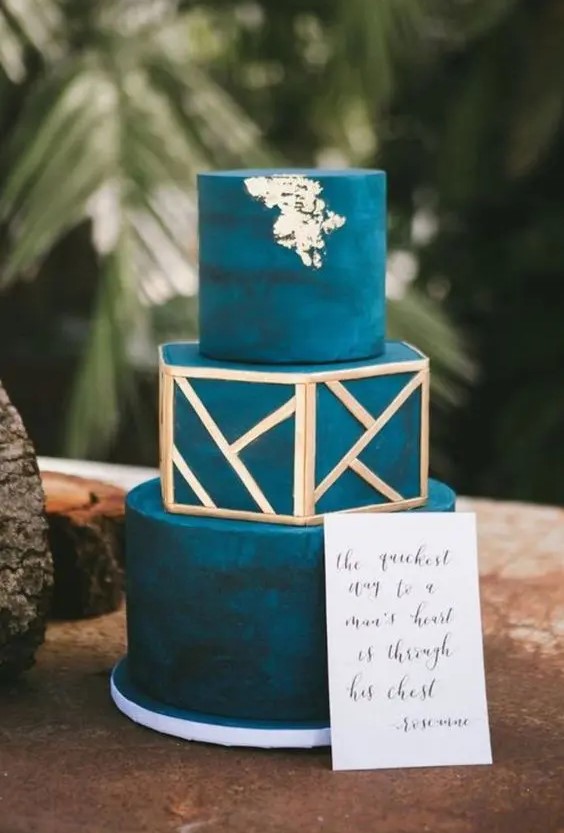 a teal wedding cake with gold geometric detailing and gold leaf is a lovely idea for a bold fall wedding