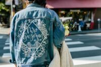 03 a blue denim painted jacket with a white image and calligraphy is a stylish idea for a boho bride