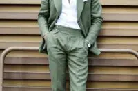 10 a green pantsuit, a white shirt and brown shoes plus green sunglasses are a fresh spring wedding guest outfit