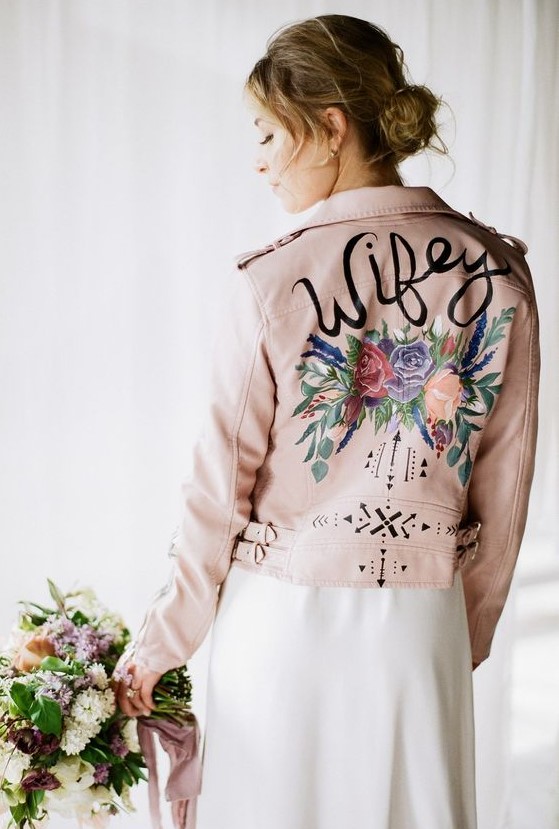 a blush leather jacket with handpainted flowers and patterns is a romantic touch to your look