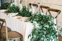 14 a super lush greenery table garland is a chic and stylish idea for a spring wedding, it looks really spectacular