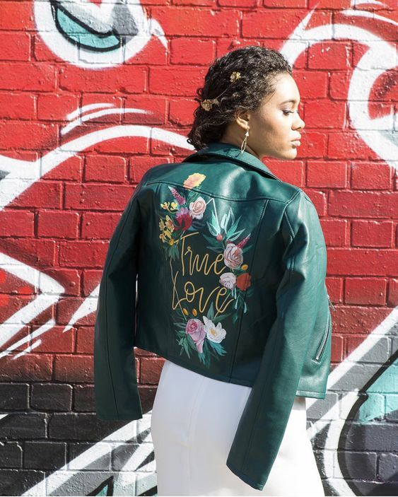 a green leather jacket with painted bright blooms and gold calligraphy is a catchy and chic idea for a wedding