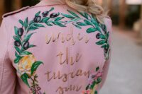 22 a pink leather jacket with hand painted blooms and olive branches and gold calligraphy for a Tuscany wedding