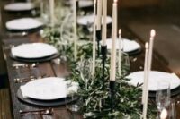 22 an olive branch wedding table runner with tall candles is an elegant and chic idea suitable for many weddings