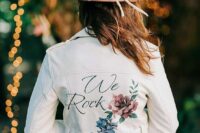 24 a white cropped leather jacket with bright painted blooms and calligraphy is a stylish and romantic solution for a boho bride