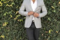 27 a simple and stylish outfit with a white shirt, a light grey blazer, black trousers, white sneakers will be a fit for a not too formal wedding