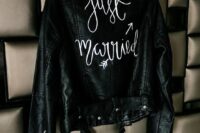 39 a black leather jacket with white calligraphy painted is a lovely cover up for a bride who wants a bit of edge