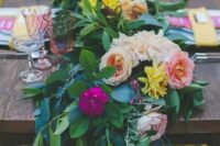 41 a super lush greenery table runner with yellow, blush and fuchsia flowers is a bold idea for summer