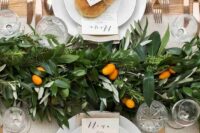47 a bold and cool textural greenery table runner dotted with citrus is a cool idea for a modern tropical or just summer wedding