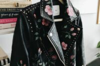 47 a gorgeous black leather jacket with hand painted blooms and studs all over the jacket, not just on the back