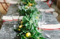 53 a lush and textural greenery table runner with fruits and yellow flowers incorporated for a bold look