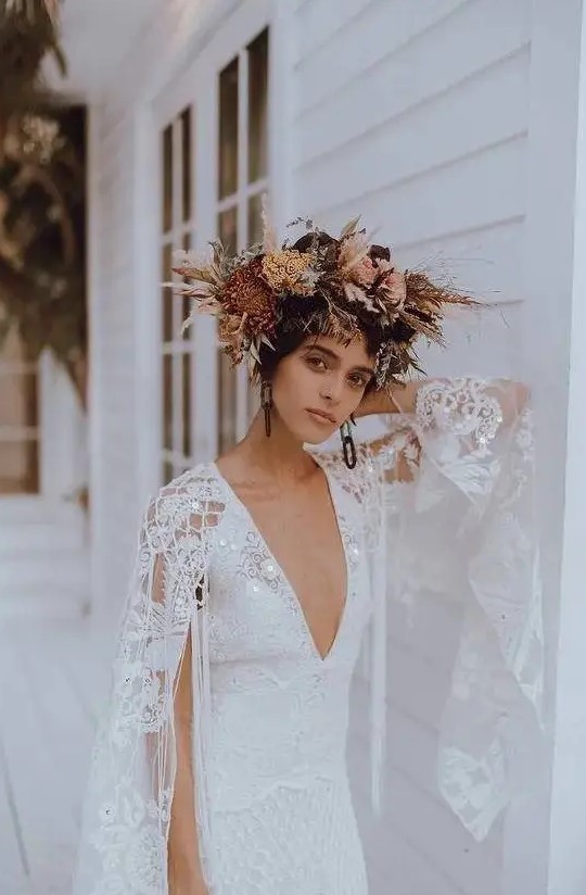 a beautiful dried flower and foliage crown with pampas grass, dried blooms and leaves and lots of twigs is a very cool idea for a boho bride