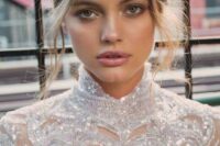 a cool bridal makeup with a glossy nude lip, a touch of blush, accented eyes is a lovely idea for a minimalist bride