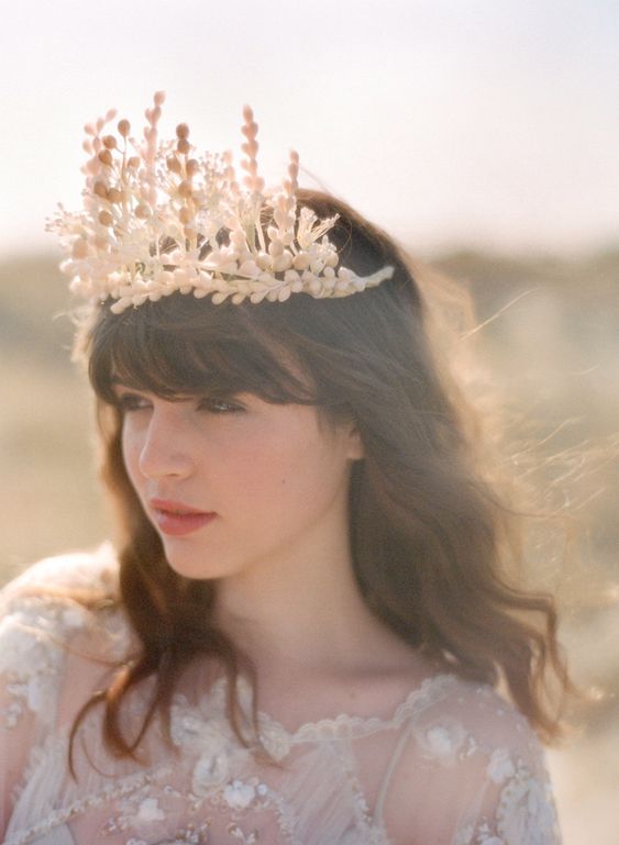 a cool dried flower crown of dried herbs and berries is a cool idea for a fall boho bride
