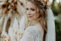 a cool rust-colored and neutral dried flower crown, a matching bouquet and wedding arch for a fall boho wedding