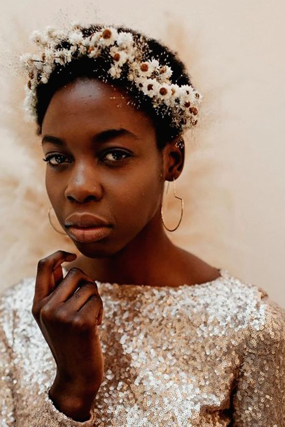a delicate dried white flower crown doesn't distract attention from the shiny sequin wedding dress