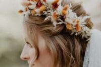 a dried flower crown with neutral, rust and burgundy bunny tails and leaves plus a polka dot veil for a fall boho bride