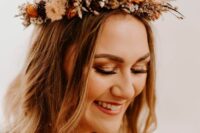 a lovely dried flower crown with neutral, rust and burgundy blooms and some twigs is a stylish and catchy idea