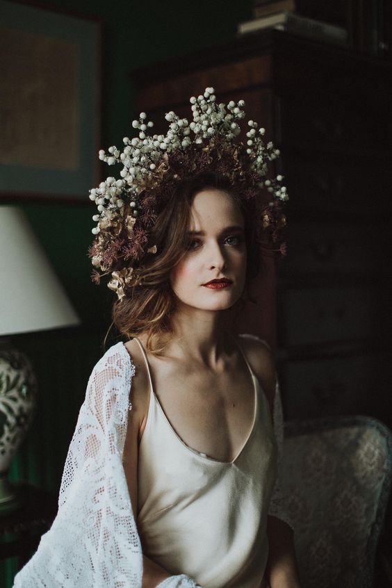 a lovely moody bridal crown of dried blooms and some white berries will be an unusual accessory for a bride