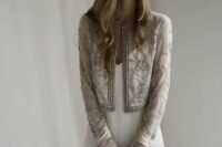 a lovely vintage-inspired neutral bridal jacket with embroidery and embellishments is a chic addition to your bridal look