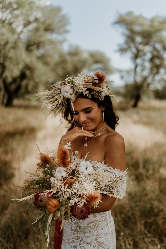 a lush and textural dried flower bridal crown with herbs, leaves, cotton and large blooms is a great idea for a summer boho bride