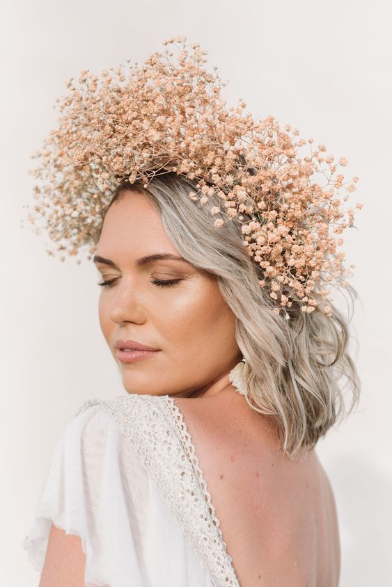 a peachy pink dried baby's breath flower crown is a stylish and very delicate addition to a spring bridal look