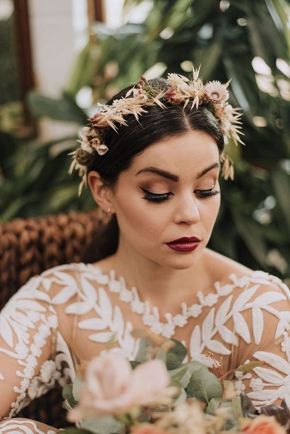 a small and delicate dried flower tiara doesn't distract attention from the bride's face and adds to the boho style