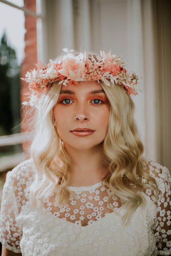 a super cool dried flower crown in white and pink that matches the bridal pink smokey eye is a cool idea for spring or summer