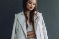 a white embellished leather jacket with gold zips is a delicate and beautiful idea for a wedding, it looks chic and gorgeous