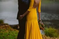 02 a bold yellow mermaid wedding dress with long sleeves and a cutout back is a modern and very bold idea for summer or fall bride