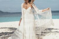 03 a boho lace spaghetti strap wedding gown with a matching coverup and a hat for a beach boho bride