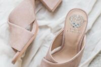 03 blush mules are a trendy statement that can finish off a tender and romantic bridal look and add an edgy feel