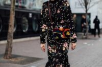 04 a beautiful black floral midi dress with a high neckline and long sleeves, black velvet boots and a black pritned bag for a winter wedding
