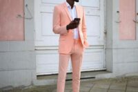 04 a bright summer or tropical wedding guest look with a neon orange suit, a white shirt and sneakers if you want to make a statement with color