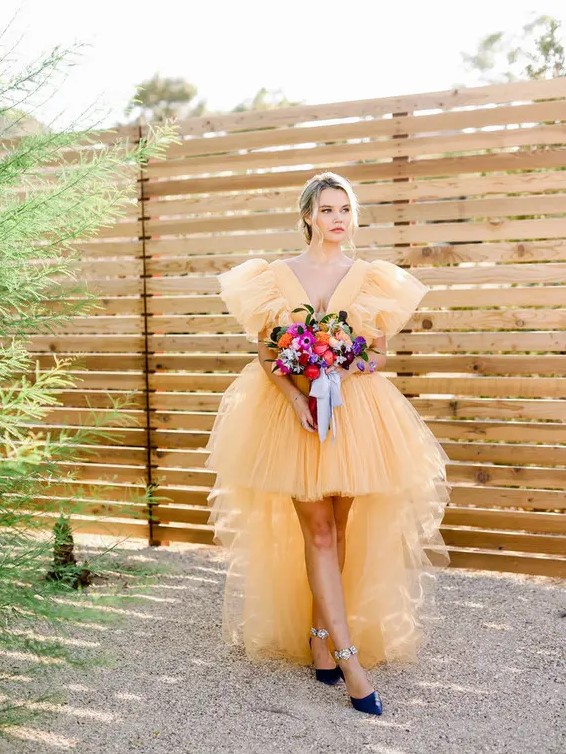 a breathtaking yellow tulle high low wedding dress and navy shoes with floral detailing for a jaw-dropping look