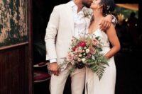 05 a bride rocking a plain mermaid wedding dress with a scoop neckline and spaghetti straps plus a sash, a groom wearing a neutral pantsuit, a white shirt and brown shoes