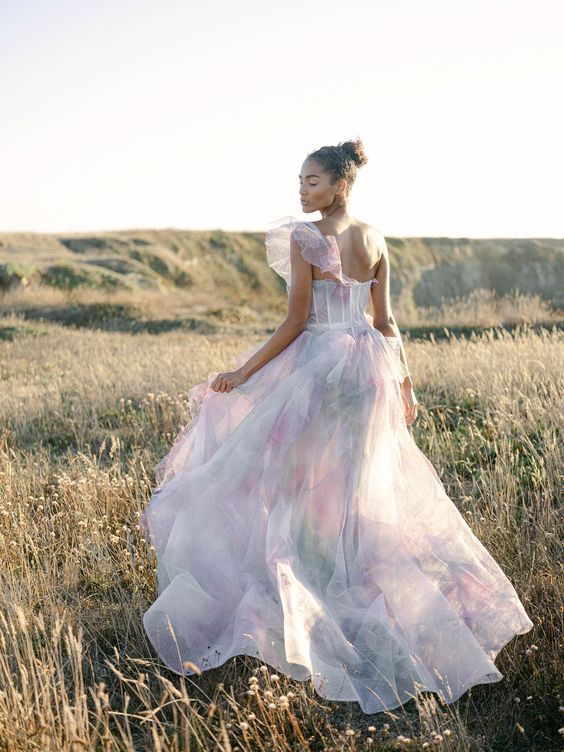 a catchy one shoulder watercolor A-line wedding dress done in pastels is amazing for spring and summer