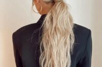 05 a classy messy and textural low ponytail with a messy top and hair wrapping it is a cool idea for a modern bridal look