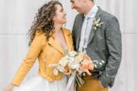 06 a bride wearing a marigold leather jacket and a groom rocking matching pants plus printed clothes look very bold and cool