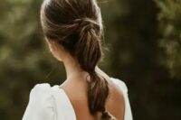 06 a cool low bubble ponytail with twists and a volume on top is a catchy idea for a classic bridal look