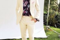 06 a creamy suit, black espadrilles and a moody floral shirt, which is great for a tropical wedding