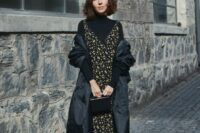 07 a black turtleneck, a moody floral midi dress over it, sock boots, a small bag and a puff midi coat