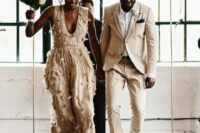 07 a bride wearing a tan floral applique wedding dress and a groom rocking a tan pantsuit, a white shirt and white sneakers
