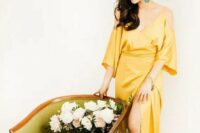 08 a modern and elegant yellow silk cold shoulder wrap wedding dress is a gorgeous idea for a color-loving bride