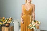 10 an elegant marigold velvet wrap spaghetti strap bridesmaid dress with a train and a matching bouquet for a fall wedding