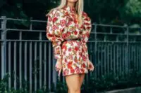 11 a bold fall wedding guest look with a mini red floral print dress with puff sleeves and a high neckline, creamy lace up booties and a black belt