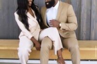 11 a tan suit, a white shirt and white sneakers for a stylish wedding guest look and to match the couple’s look